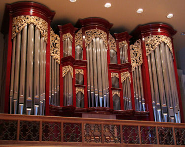 Gold leaf accents and highlights in wood carved pipe shades of organ at Vassar College, Poughkeepsie, New York